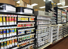 Artist paints at the Frame & Art Center in Las Cruces